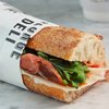 UMH Group opent eerste vestiging George Deli in de Houthavens